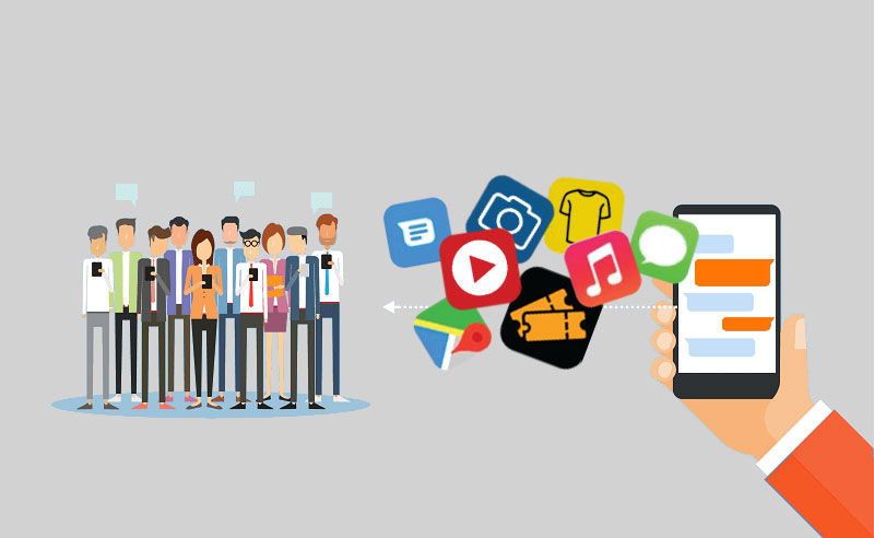 A crowd of people beside a hand holding a phone, surrounded by social media and messaging app icons